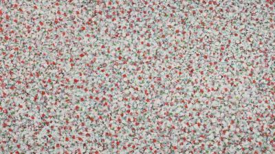 Abstract painting with dense white and red-toned brushstrokes creating a vibrant, light-filled, shimmering texture.